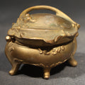 Lot 115 - Antique Art Nouveau Gold-Tone Footed Jewelry Casket with Floral Scroll Motif and Silk Lining, Manufactured by B. & W., No. 126, 2" H