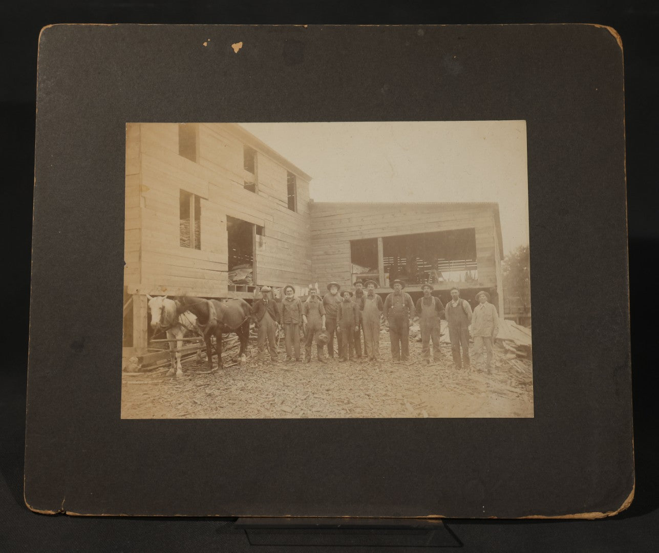 Antique Board-Mounted Occupational Photograph of 11 Mill Workers and Two Horses, Pencil-Inscribed "George Burnham - Mill"