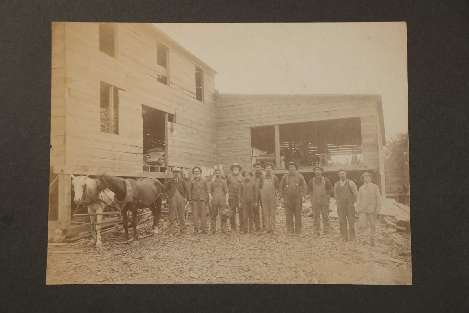 Antique Board-Mounted Occupational Photograph of 11 Mill Workers and Two Horses, Pencil-Inscribed "George Burnham - Mill"
