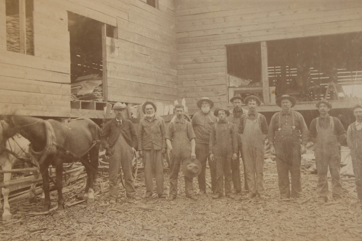 Antique Board-Mounted Occupational Photograph of 11 Mill Workers and Two Horses, Pencil-Inscribed "George Burnham - Mill"