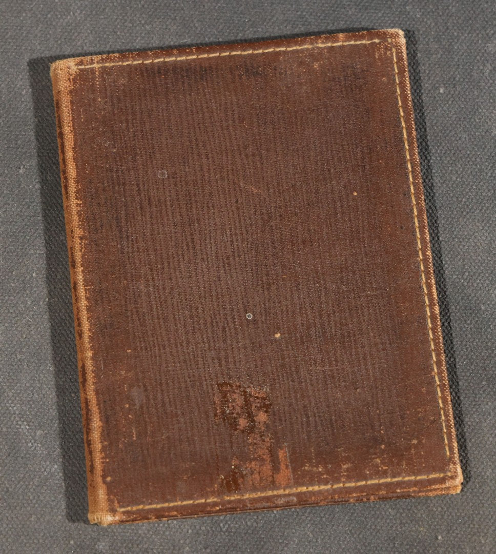 Antique Foldered Tintype Photograph of a Man Holding a Small Dog