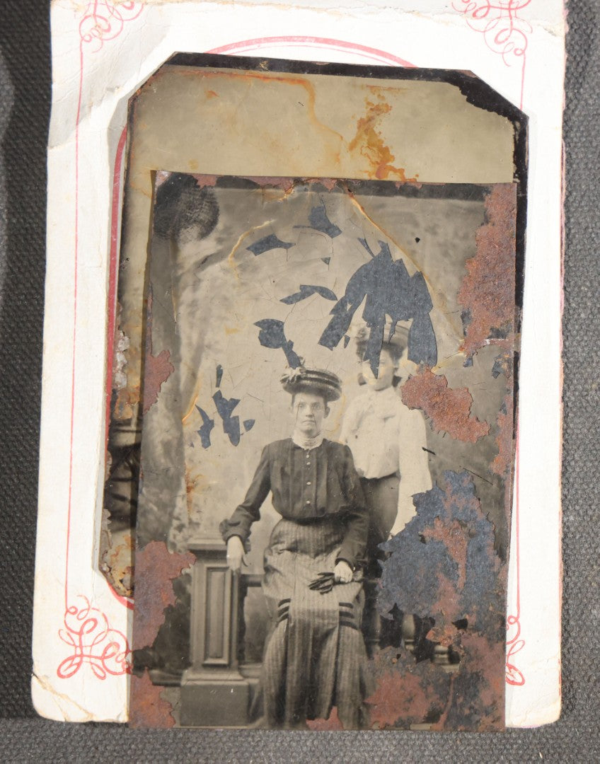 Grouping of 15 Antique Tintype Photographs including Man in Top Hat with Cane, Group of Women in White Dresses and Hats, Seated Couples, and Paper-Matted Portrait of a Seated Woman