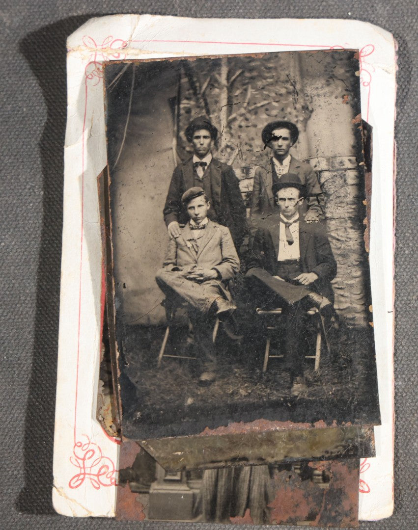 Grouping of 15 Antique Tintype Photographs including Man in Top Hat with Cane, Group of Women in White Dresses and Hats, Seated Couples, and Paper-Matted Portrait of a Seated Woman