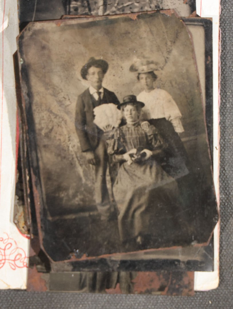 Grouping of 15 Antique Tintype Photographs including Man in Top Hat with Cane, Group of Women in White Dresses and Hats, Seated Couples, and Paper-Matted Portrait of a Seated Woman