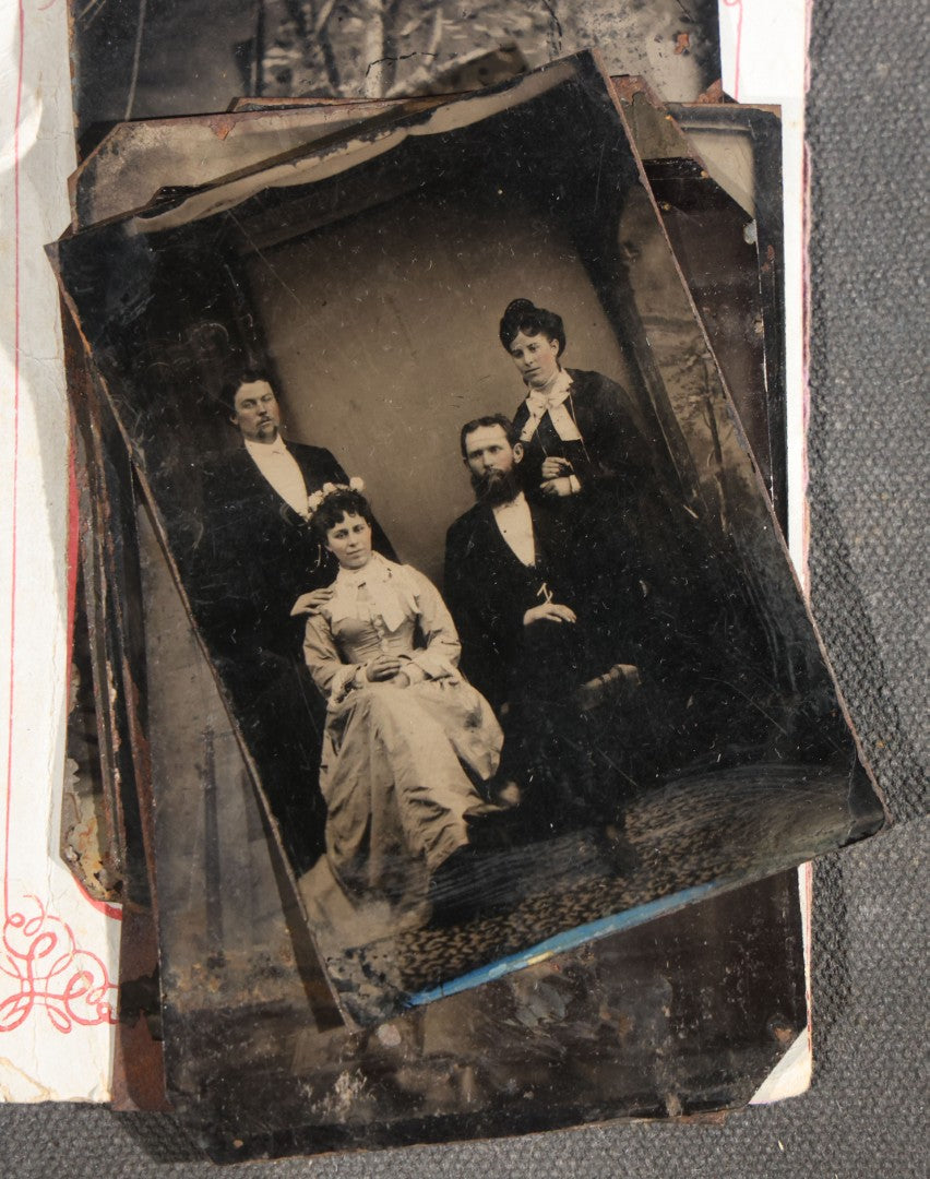 Grouping of 15 Antique Tintype Photographs including Man in Top Hat with Cane, Group of Women in White Dresses and Hats, Seated Couples, and Paper-Matted Portrait of a Seated Woman