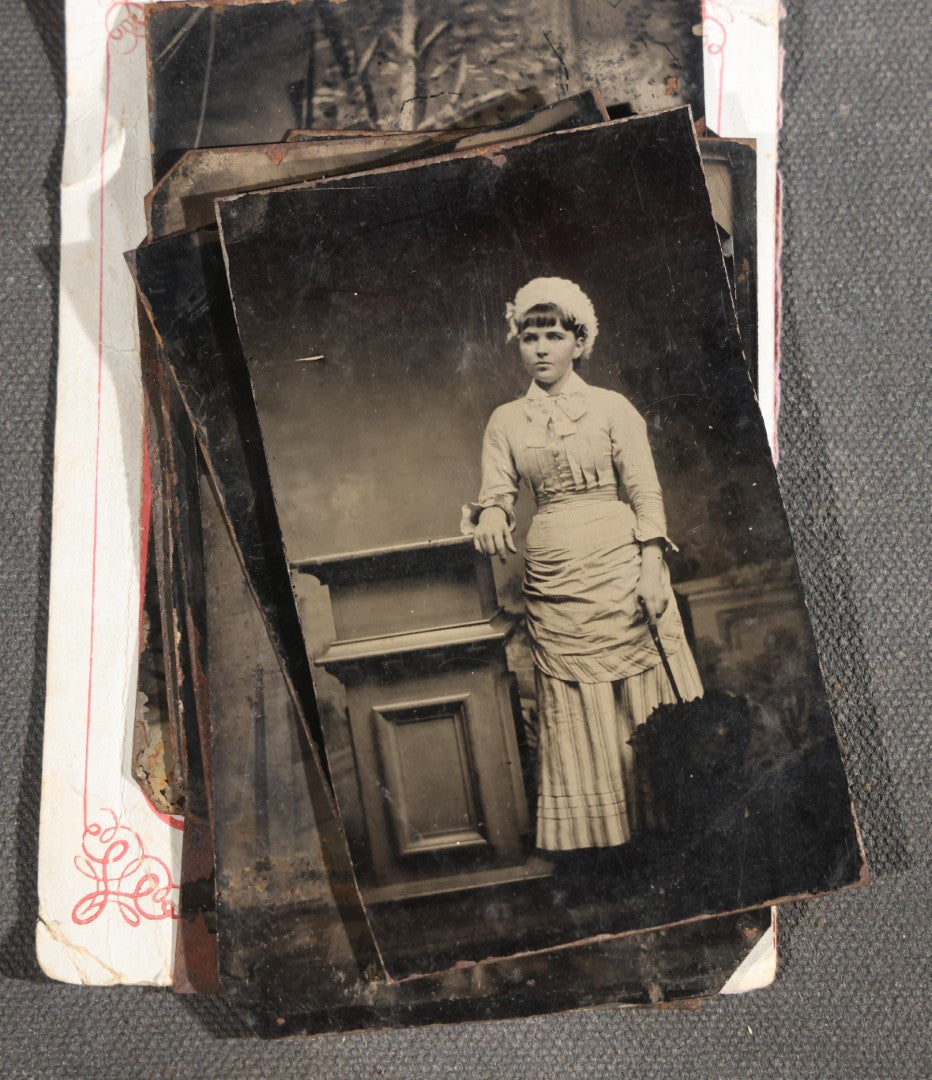 Grouping of 15 Antique Tintype Photographs including Man in Top Hat with Cane, Group of Women in White Dresses and Hats, Seated Couples, and Paper-Matted Portrait of a Seated Woman