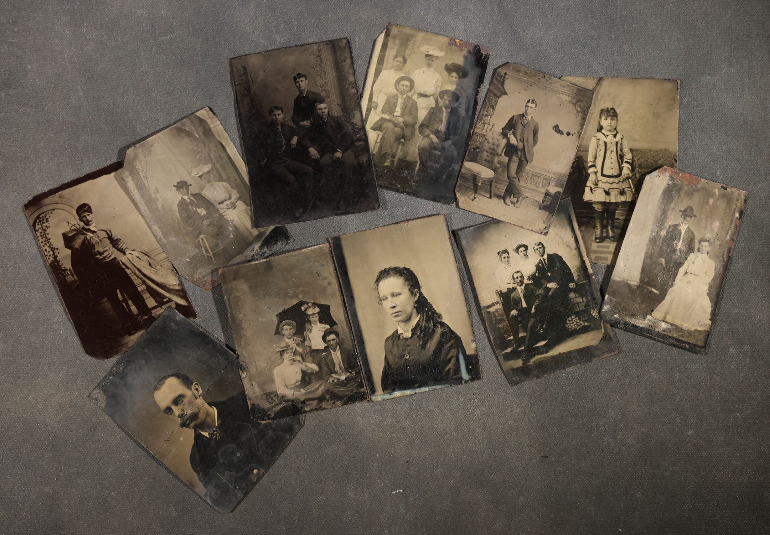 Grouping of 11 Antique Tintype Photographs, Portraits of Men, Women, Children, Couples, and Family Groups
