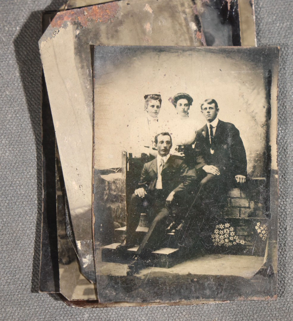 Grouping of 11 Antique Tintype Photographs, Portraits of Men, Women, Children, Couples, and Family Groups