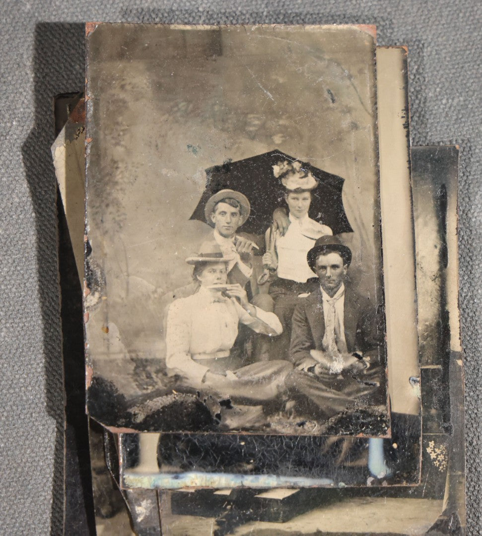 Grouping of 11 Antique Tintype Photographs, Portraits of Men, Women, Children, Couples, and Family Groups
