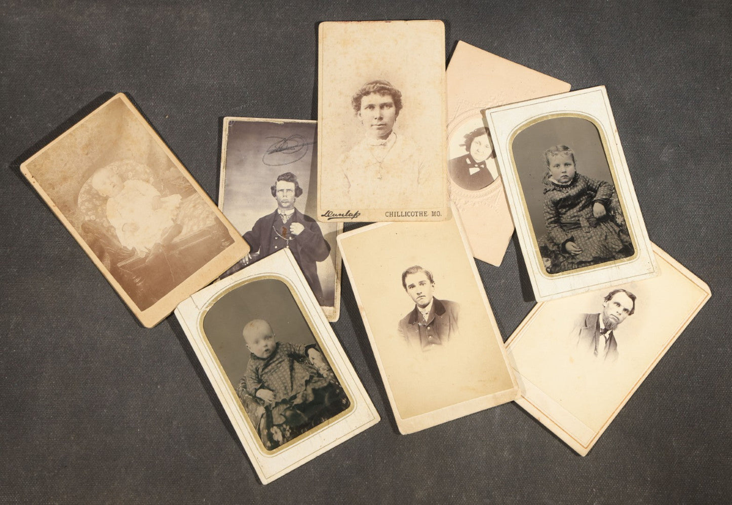 Grouping of Nine Antique Photographs including Two Tintype Photographs and Seven Carte de Visite C.D.V. Portraits, Babies, Children, Young Men, and Young Woman, One by Dunlap, Chillicothe, Missouri