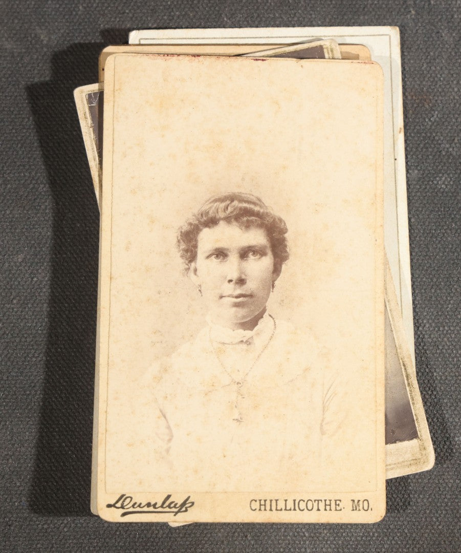 Grouping of Nine Antique Photographs including Two Tintype Photographs and Seven Carte de Visite C.D.V. Portraits, Babies, Children, Young Men, and Young Woman, One by Dunlap, Chillicothe, Missouri
