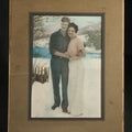 Lot 140 - Vintage Tinted Photograph of a Couple Posed Before a Winter Landscape, in Paper Frame