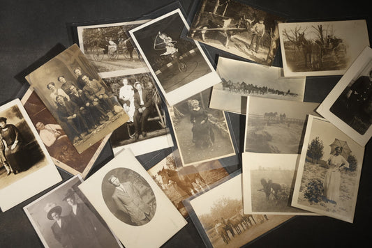 Grouping of 18 Antique and Vintage Real Photo Postcards R.P.P.C. including Unicyclist Performer with Hula Hoop, Horse and Buggy, Mule Team, Man Fishing, Woman with Parasol, Studio Portraits, and Family Groups