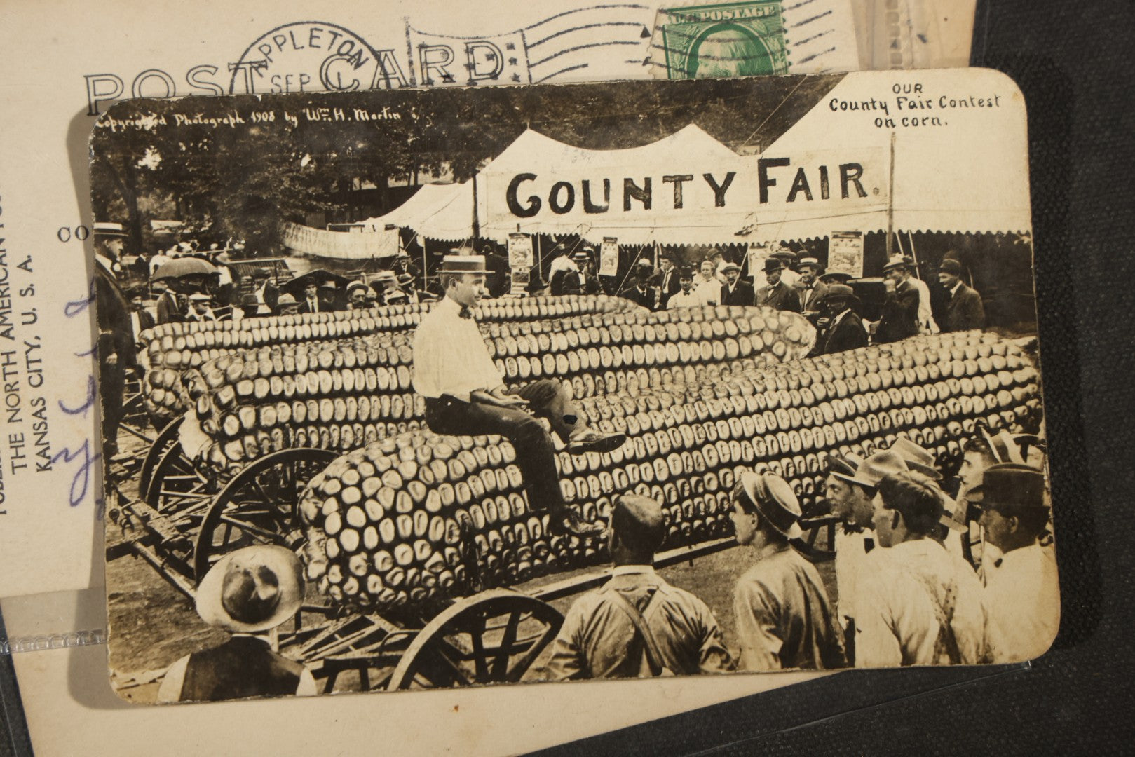 Grouping of Six Antique Exaggeration Real Photo Postcards R.P.P.C., Photographed by W.H. Martin, Including "The Largest Ear of Corn Grown in Mo.," "Watermelons Grow Big in Kans.," And "Our County Fair Contest on Corn," 1907-1910