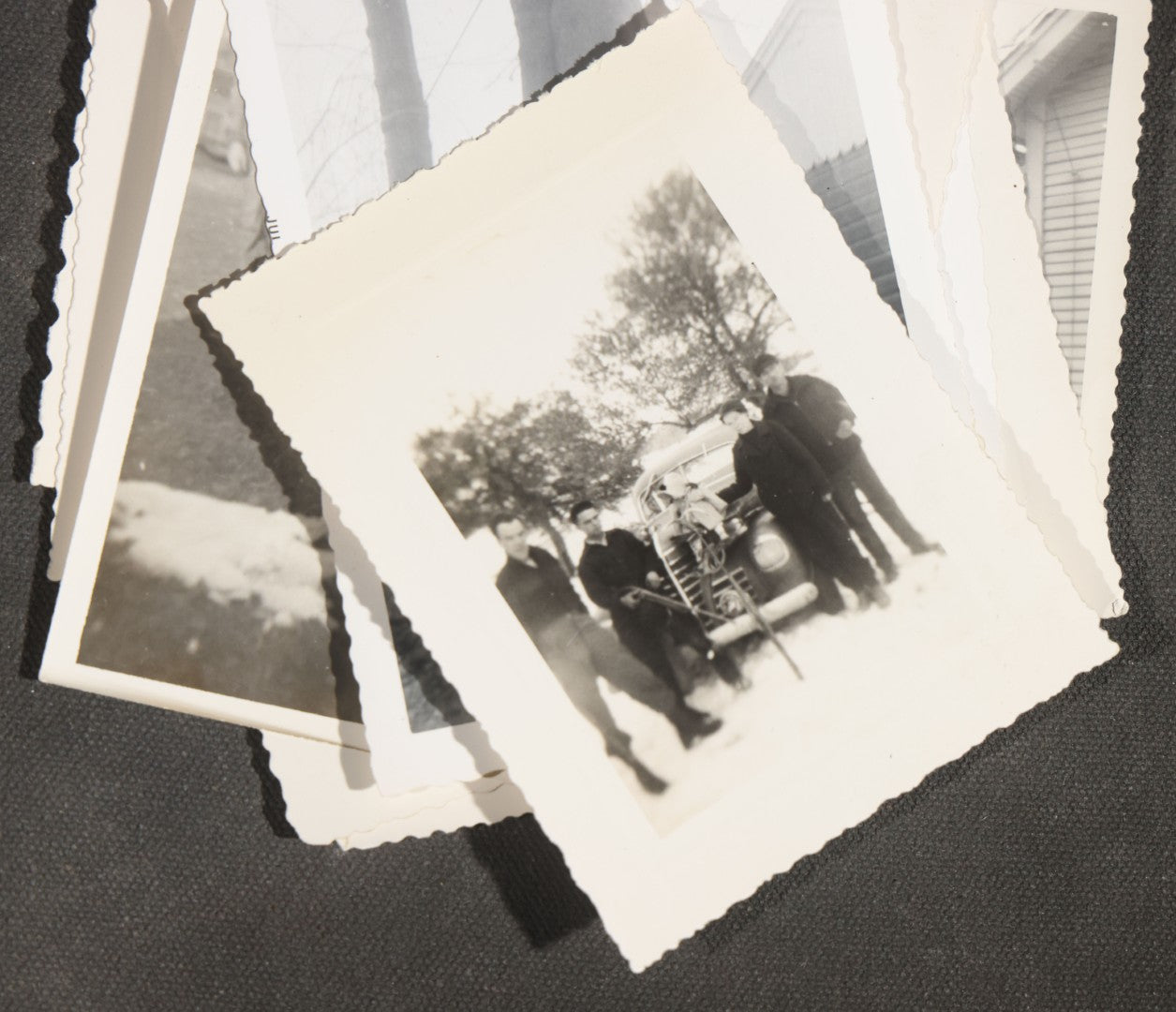 Grouping of 12 Vintage Hunting Snapshot Photographs, Men with Harvested Deer and Birds, Deer on Car Roof, Jeep, Dogs, and Rural Family Scenes, Circa 1940s-1950s