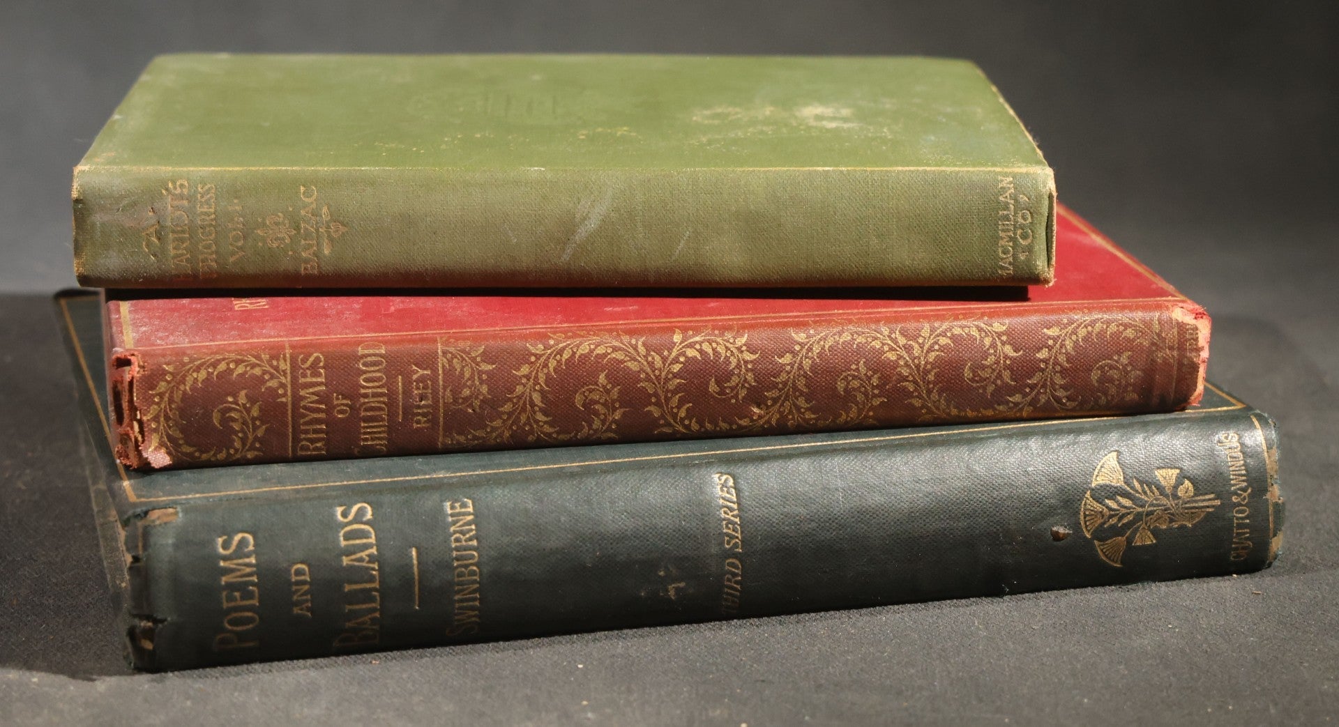 Trio of Antique Poetry and Literature Books including "A Harlot's Progress" by H. De Balzac, "Poems and Ballads" by Algernon Charles Swinburne, and "Rhymes of Childhood" by James Whitcomb Riley