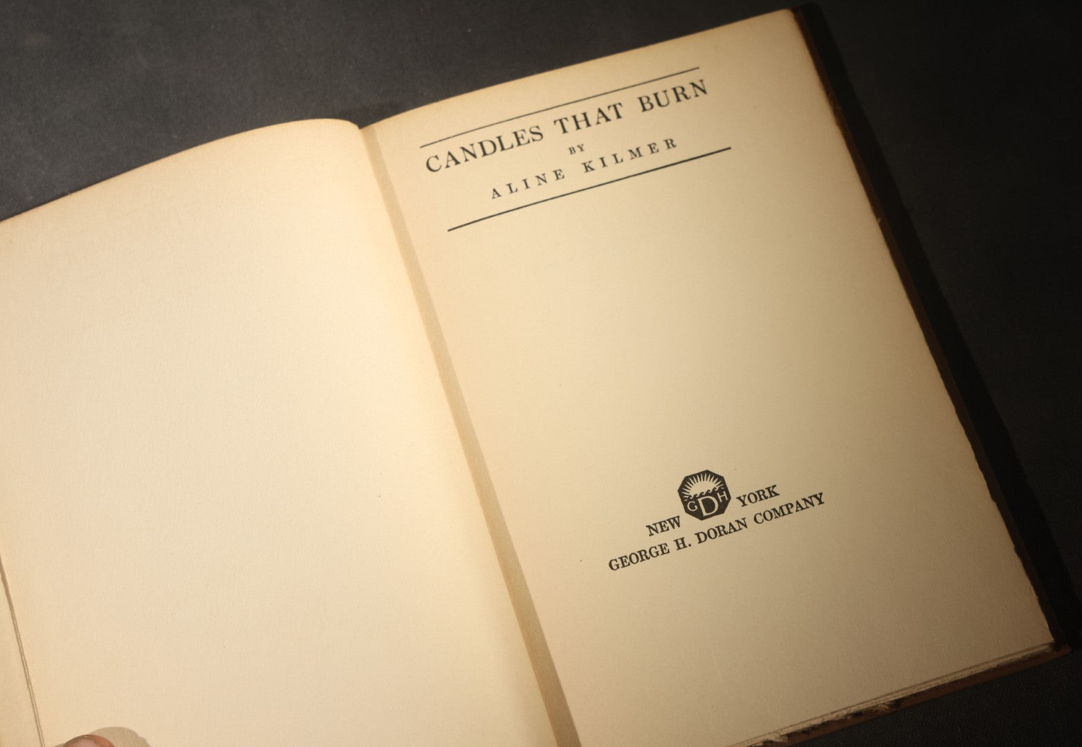 Trio of Antique and Vintage Poetry and Literature Books including "Candide" by Voltaire, "Candles That Burn" by Aline Kilmer, and "Flowers of Evil" by Charles Baudelaire