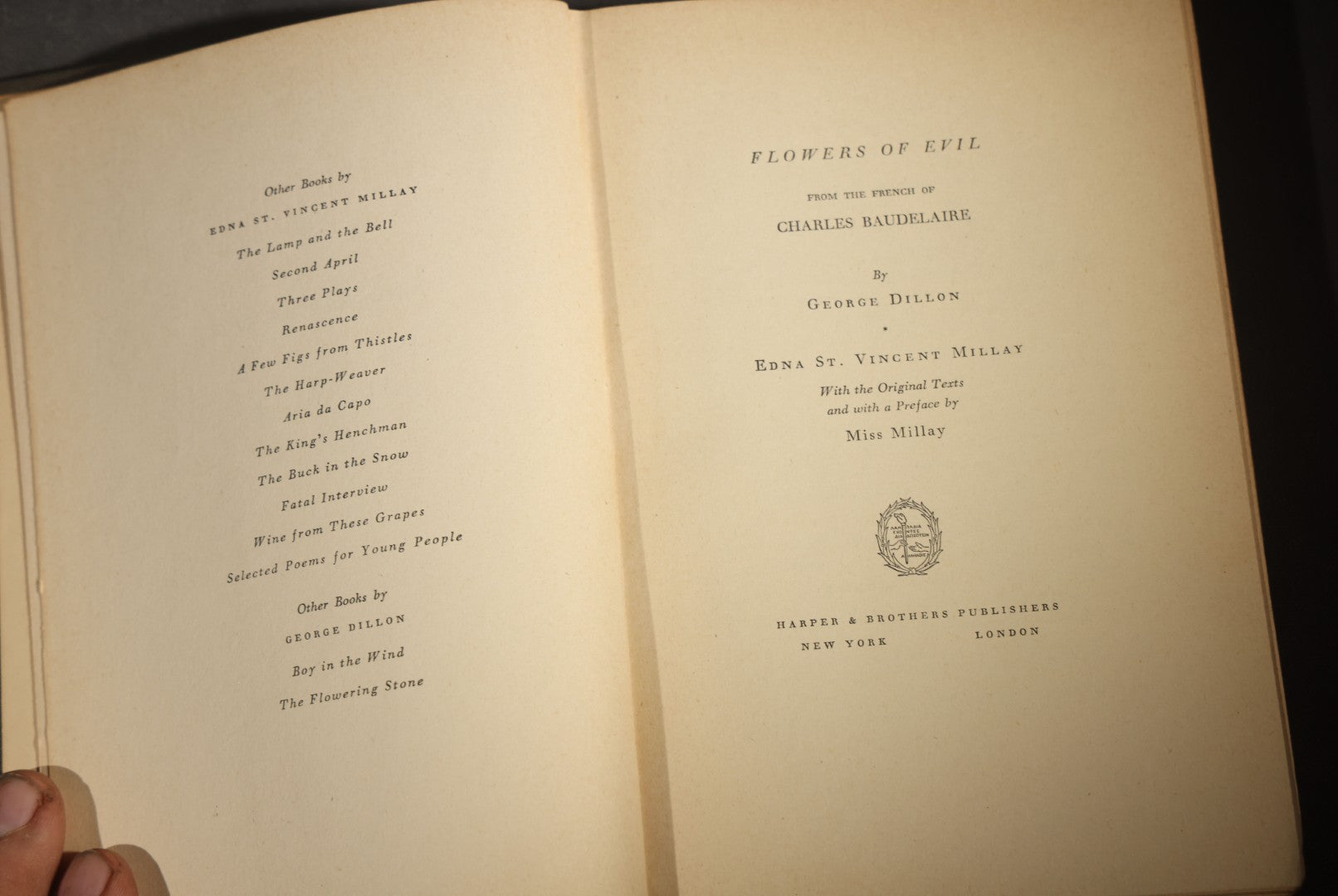 Trio of Antique and Vintage Poetry and Literature Books including "Candide" by Voltaire, "Candles That Burn" by Aline Kilmer, and "Flowers of Evil" by Charles Baudelaire
