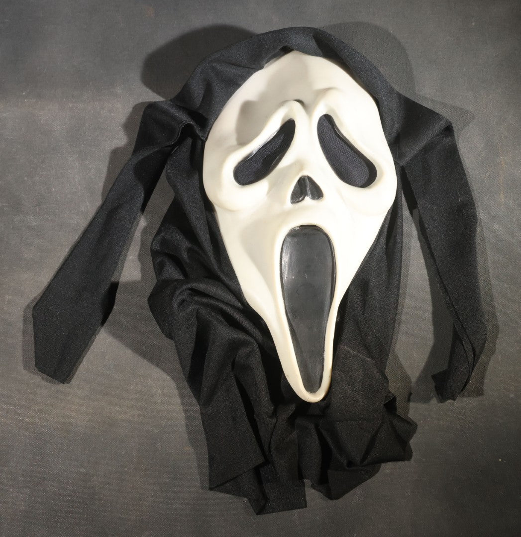 Modern Glow-in-the-Dark Ghostface "Scream" Halloween Mask with Black Fabric Hood, Manufactured by Easter Unlimited Inc., Made in China, Circa Early 2000s