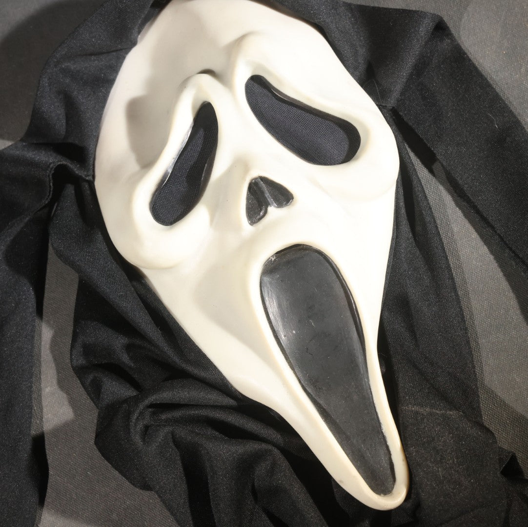 Modern Glow-in-the-Dark Ghostface "Scream" Halloween Mask with Black Fabric Hood, Manufactured by Easter Unlimited Inc., Made in China, Circa Early 2000s