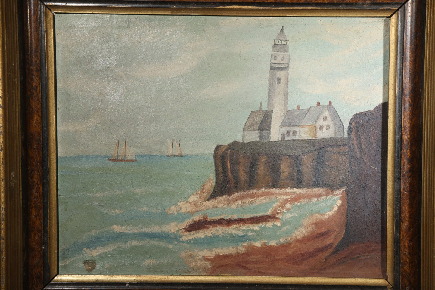 Antique Framed Oil Painting on Board, Coastal Lighthouse on Rocky Cliffs with Sailing Vessels