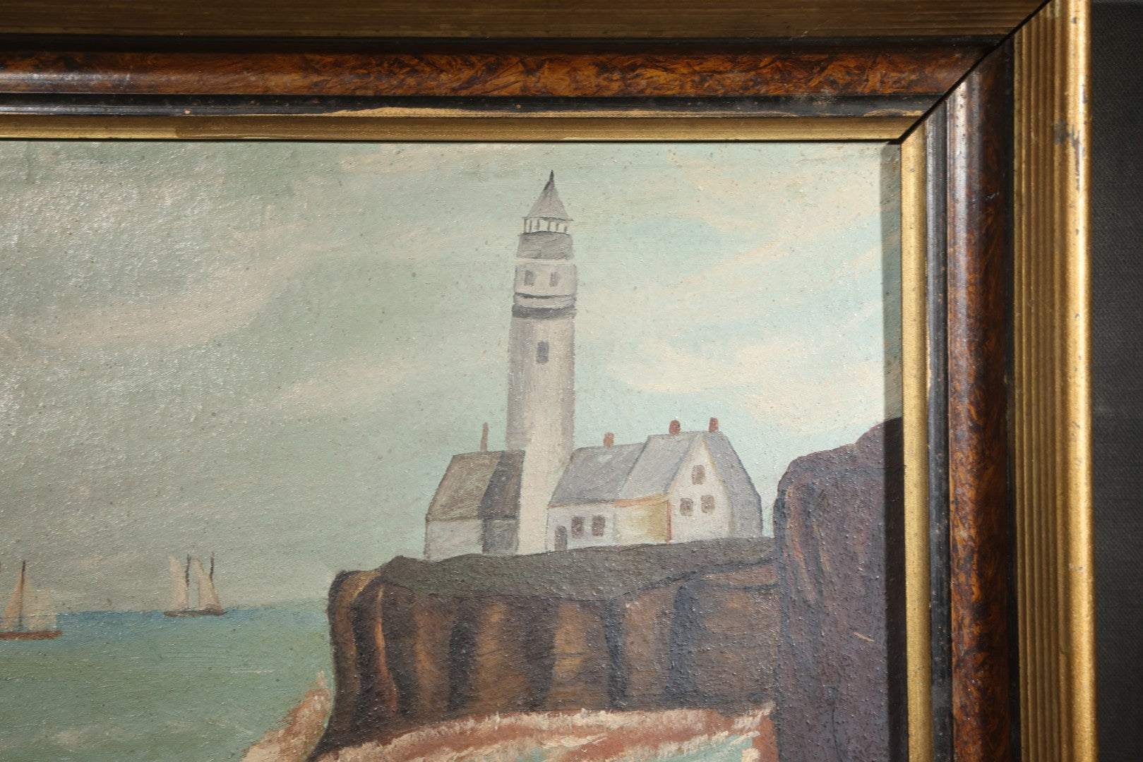 Antique Framed Oil Painting on Board, Coastal Lighthouse on Rocky Cliffs with Sailing Vessels