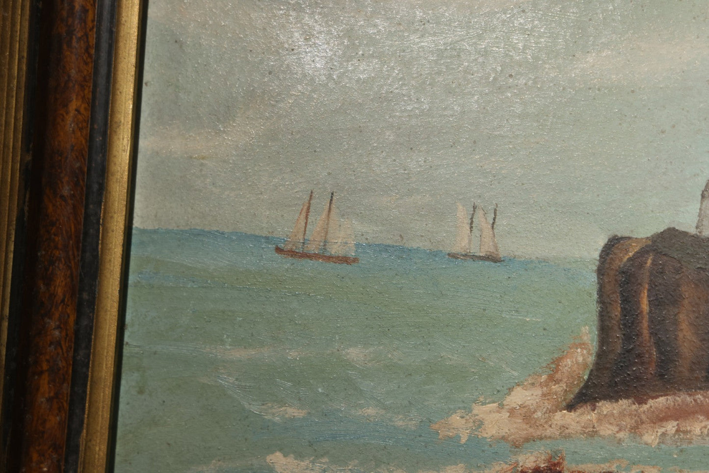 Antique Framed Oil Painting on Board, Coastal Lighthouse on Rocky Cliffs with Sailing Vessels