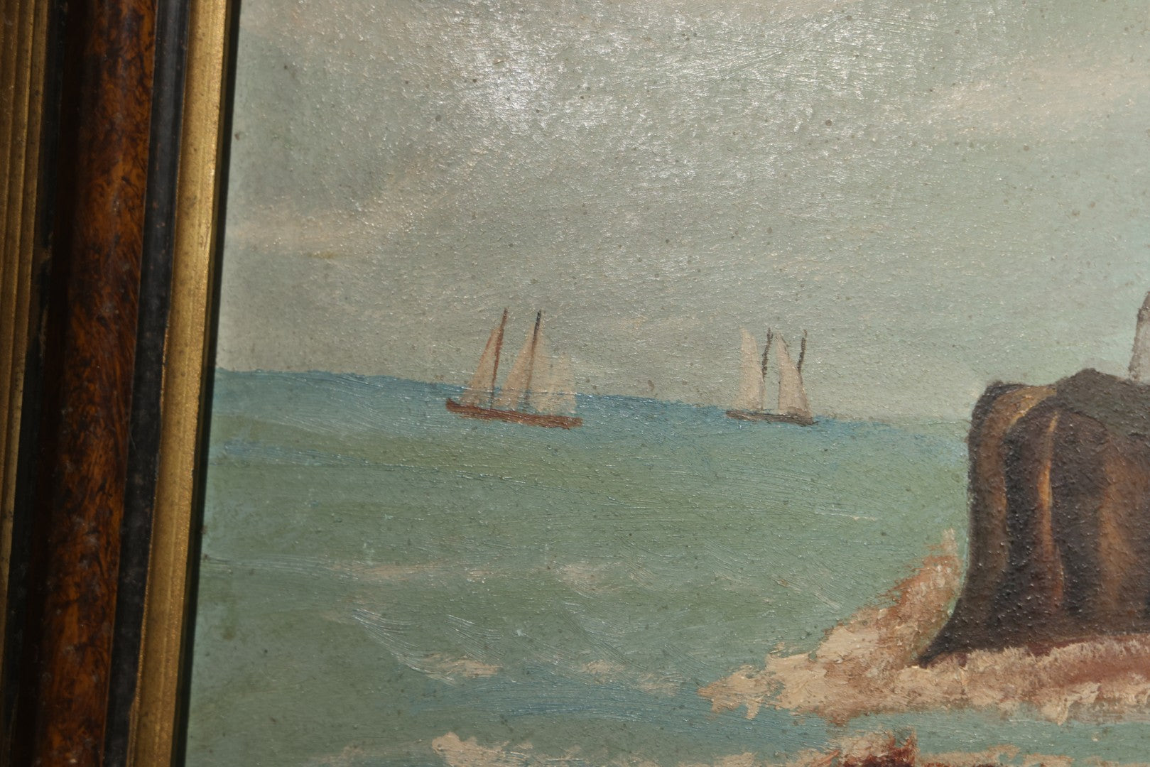 Antique Framed Oil Painting on Board, Coastal Lighthouse on Rocky Cliffs with Sailing Vessels