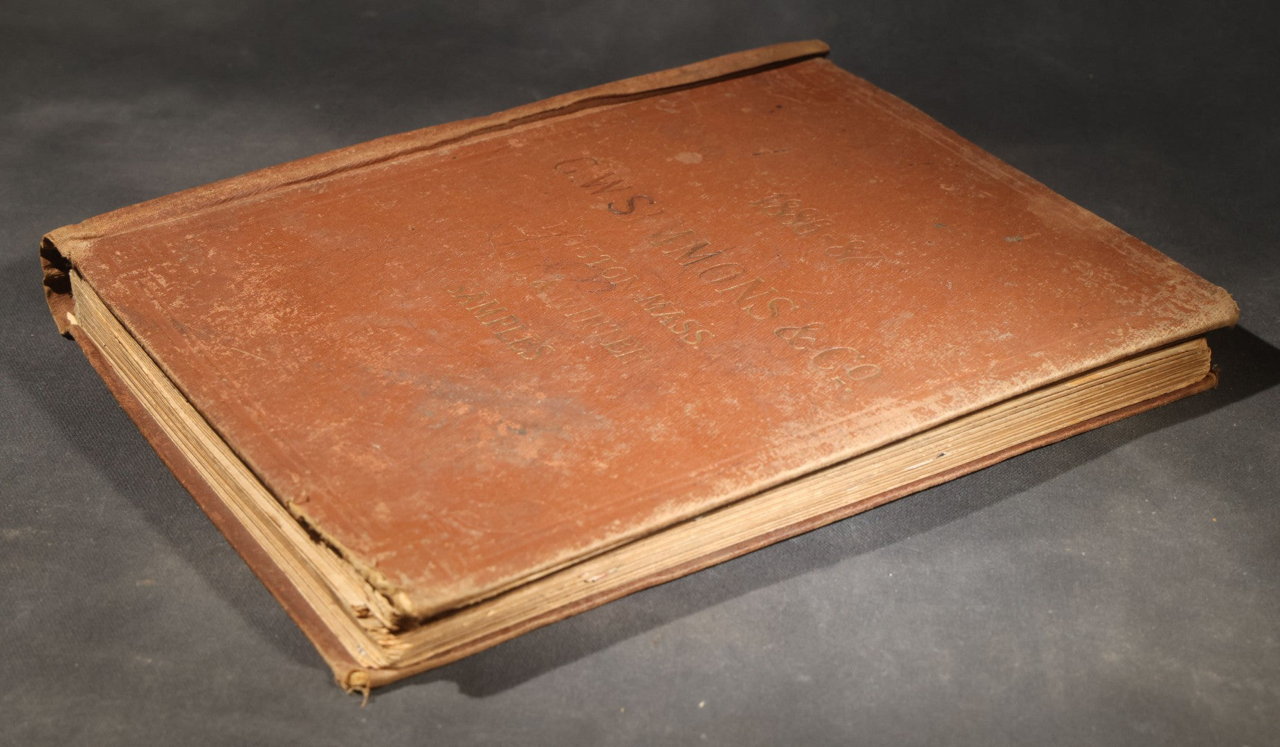Antique Victorian Scrapbook Assembled in a Repurposed 1886-87 G.W. Simmons & Co. Fall & Winter Samples Catalog, Boston, Massachusetts, with Trade Cards including Reynolds Brothers Fine Shoes, Scoville's Sarsaparilla, and Loewenstine & Co.