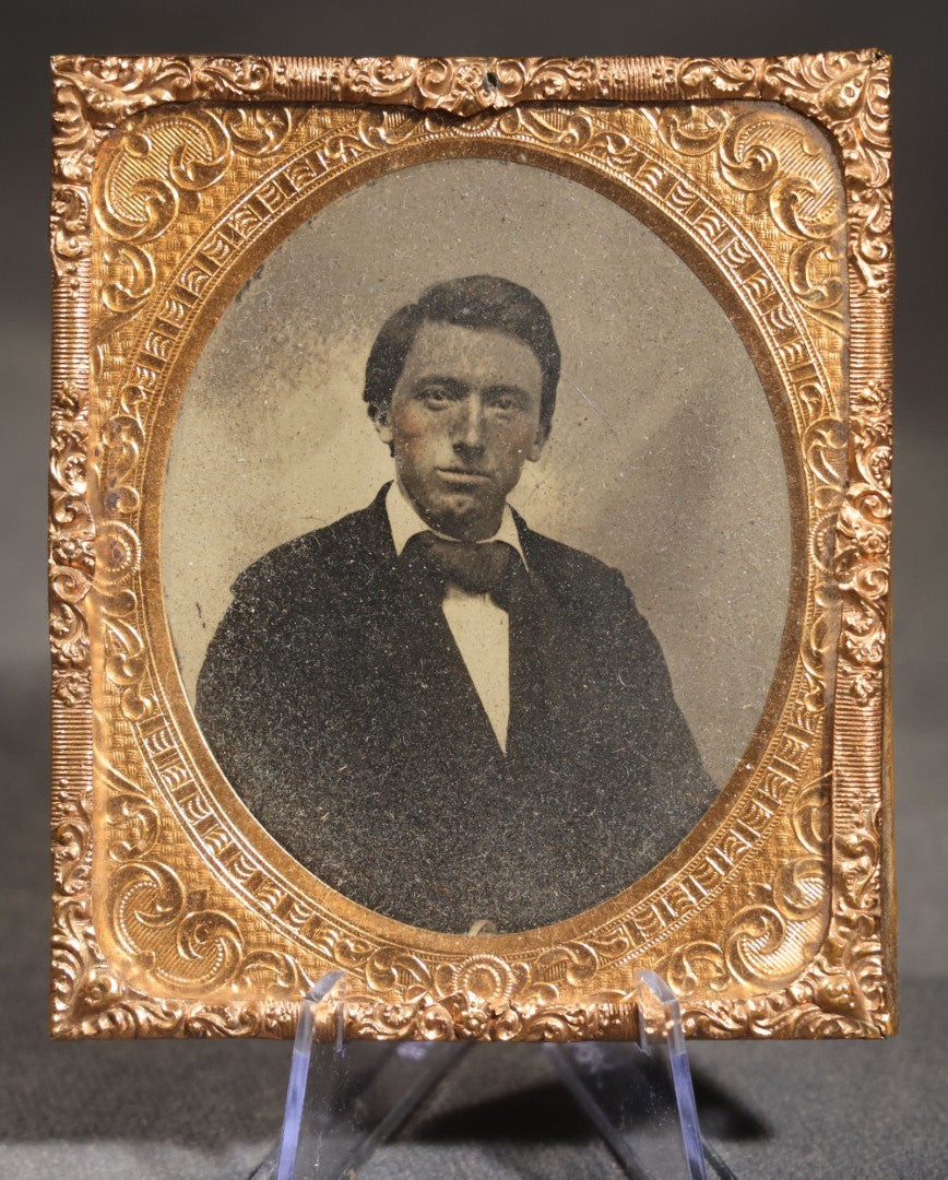 Antique 1/9th Plate Tintype Photograph of a Young Man in Suit and Bow Tie, Uncased with Brass Mat and Preserver