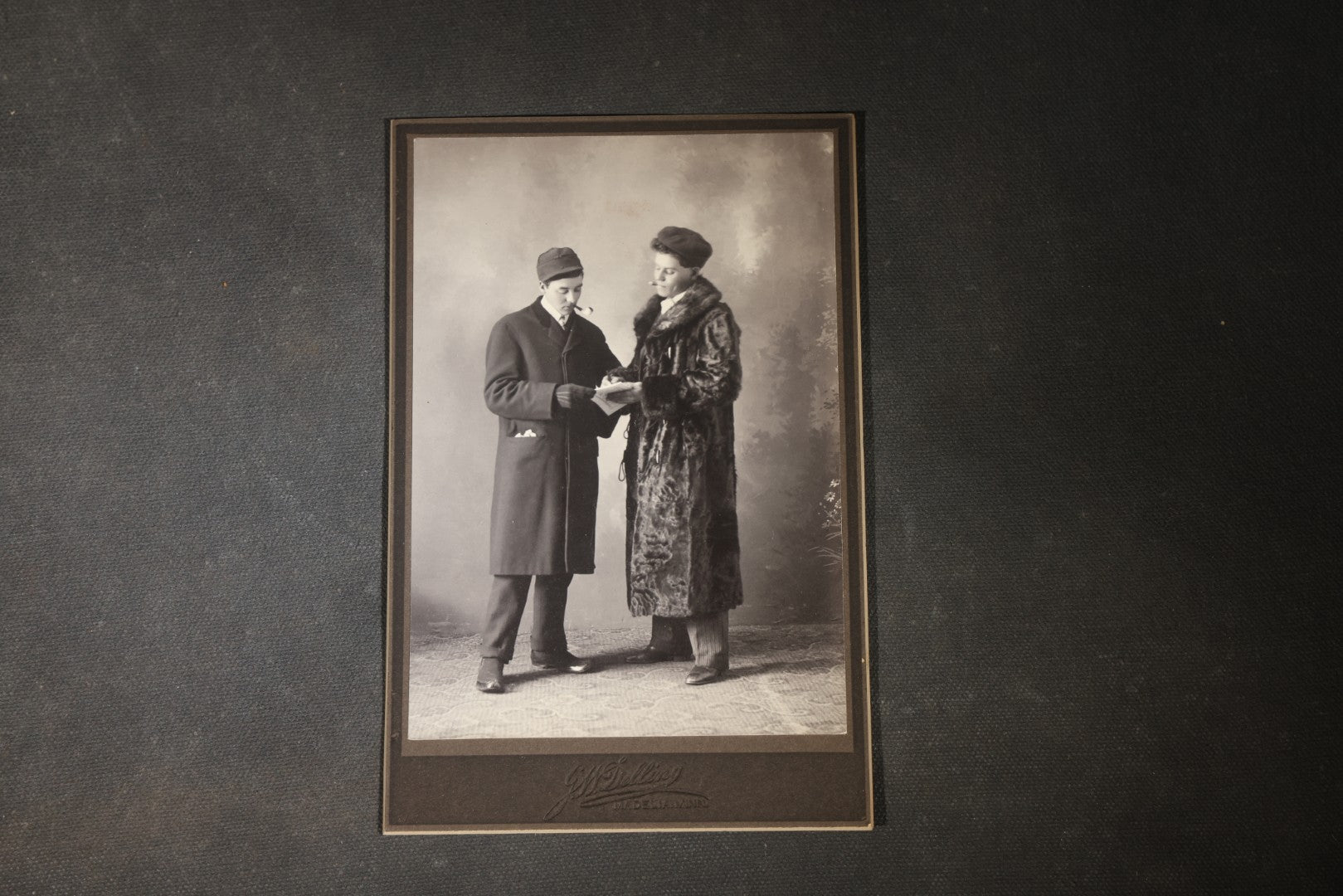 Grouping of 35+ Antique Cabinet Card and Board-Mounted Photographs including Schoolroom Interior and Posed Couple in Fur Coats