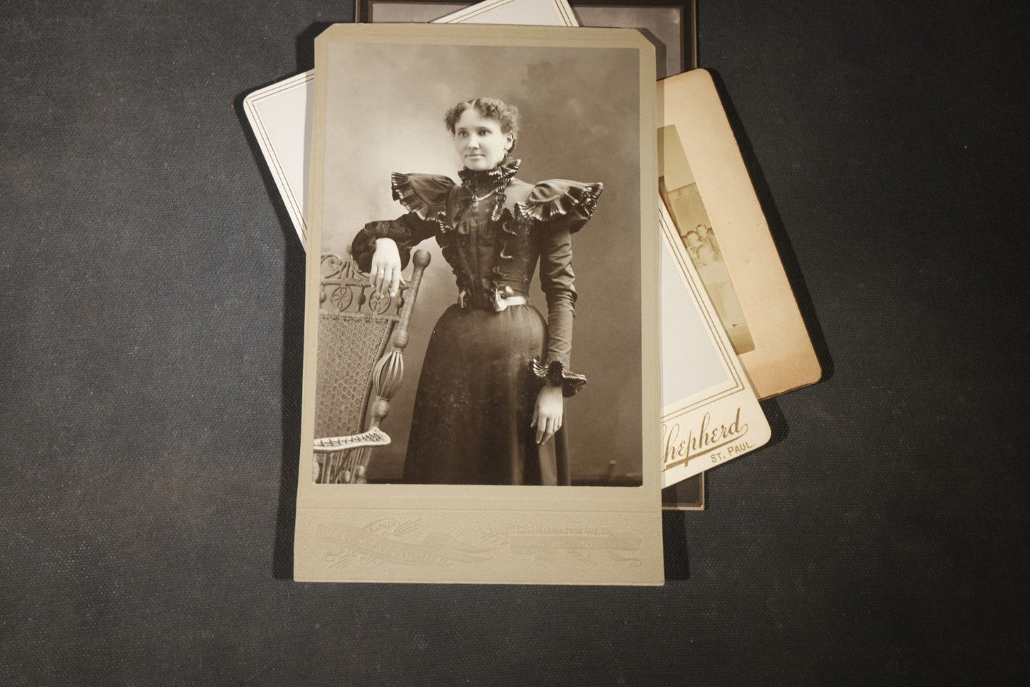 Grouping of 35+ Antique Cabinet Card and Board-Mounted Photographs including Schoolroom Interior and Posed Couple in Fur Coats