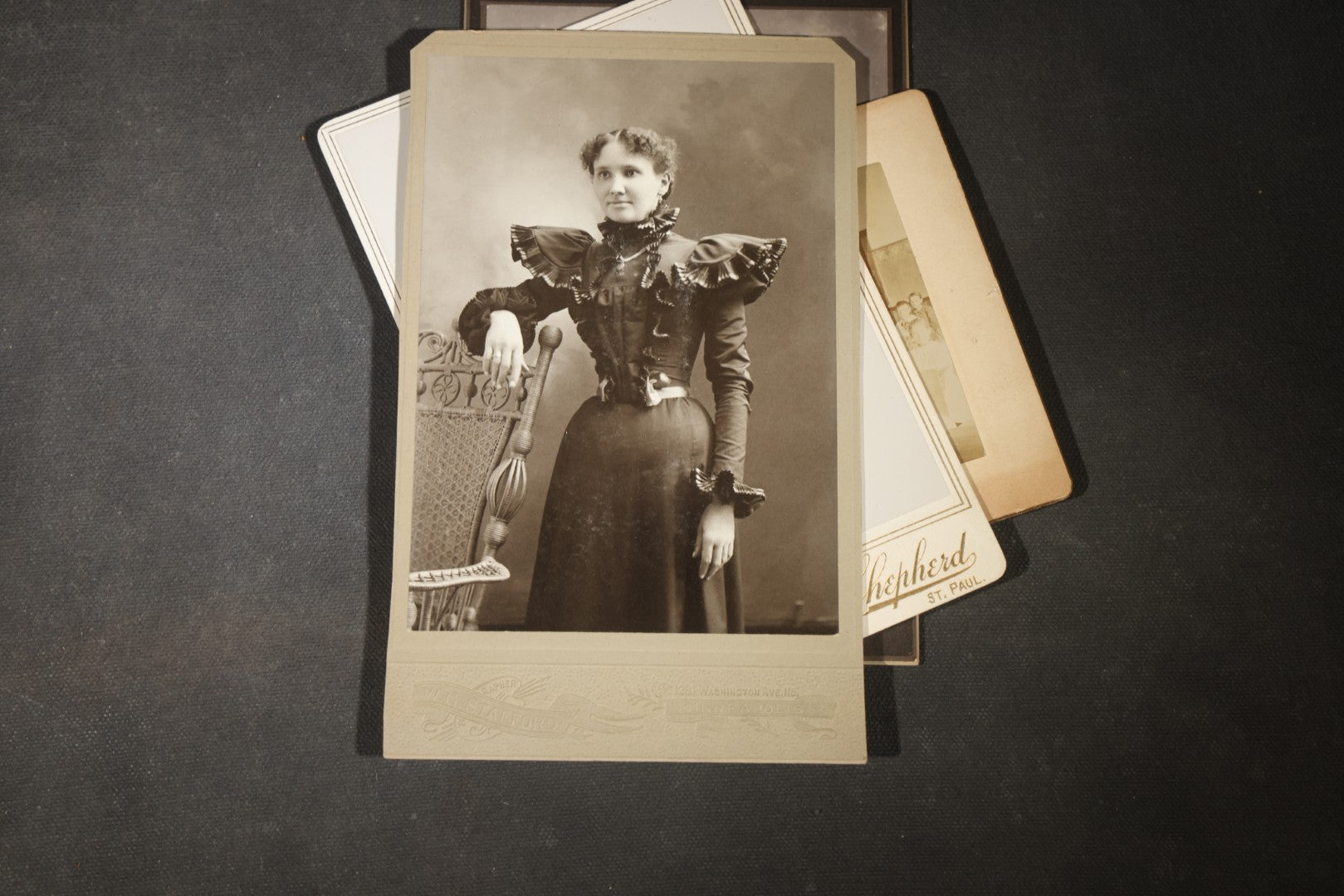 Grouping of 35+ Antique Cabinet Card and Board-Mounted Photographs including Schoolroom Interior and Posed Couple in Fur Coats