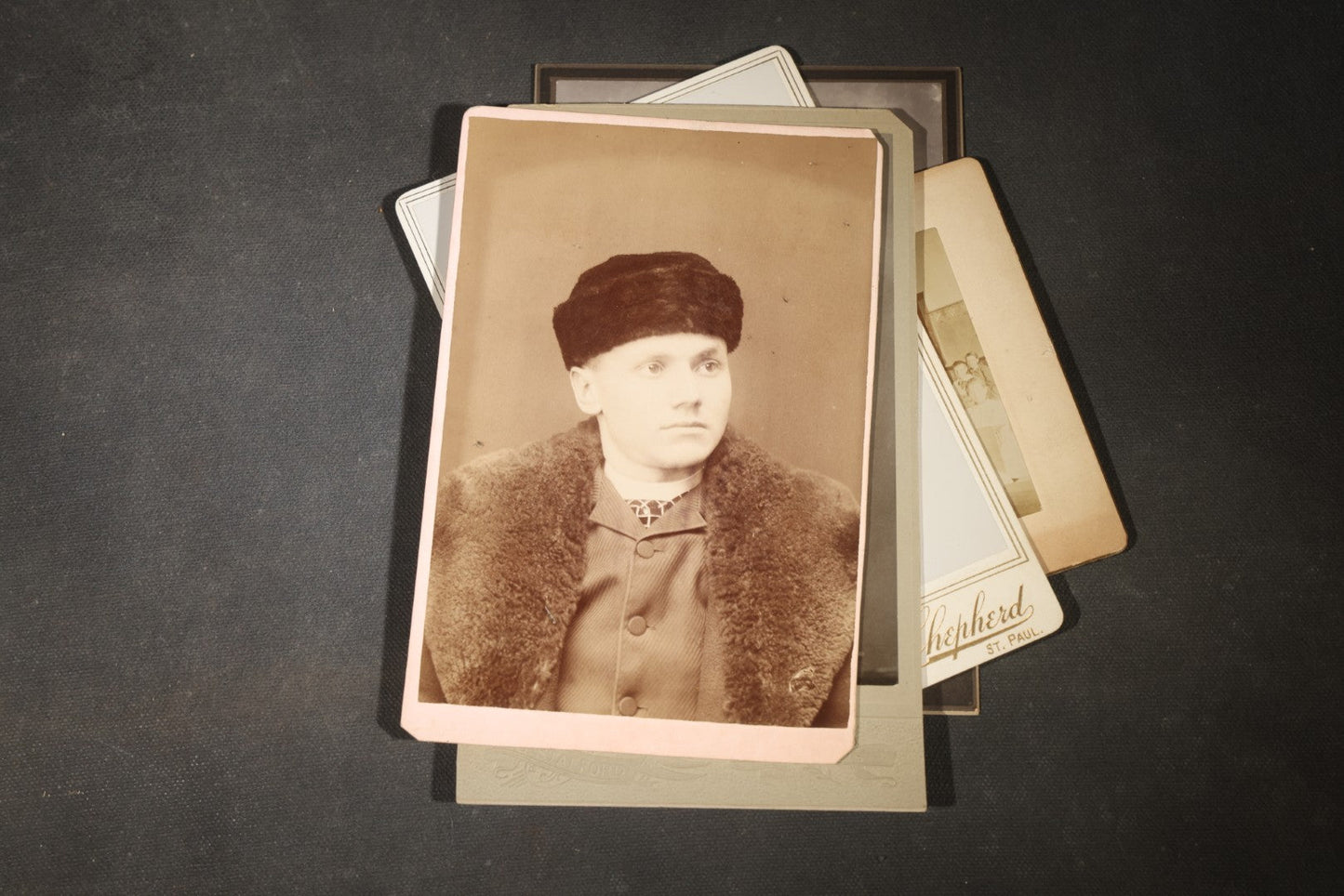 Grouping of 35+ Antique Cabinet Card and Board-Mounted Photographs including Schoolroom Interior and Posed Couple in Fur Coats