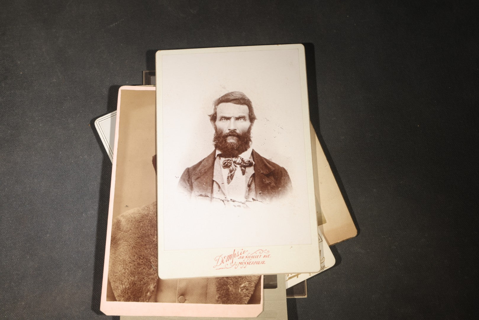Grouping of 35+ Antique Cabinet Card and Board-Mounted Photographs including Schoolroom Interior and Posed Couple in Fur Coats