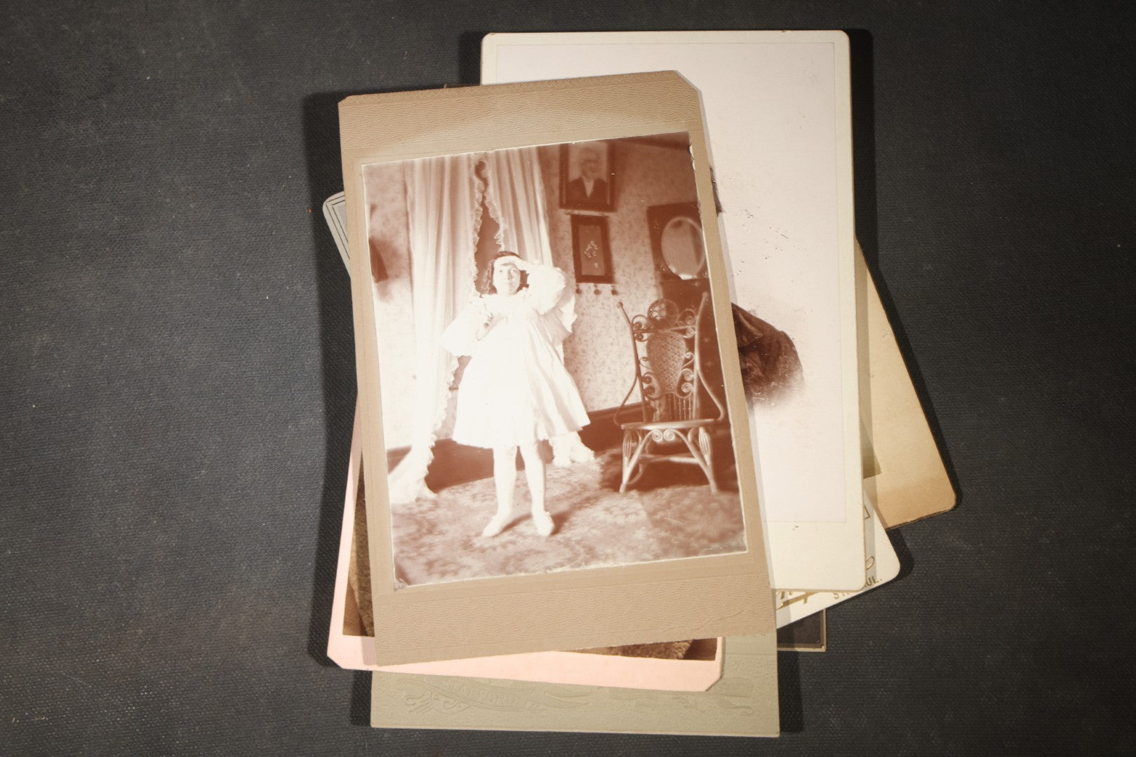 Grouping of 35+ Antique Cabinet Card and Board-Mounted Photographs including Schoolroom Interior and Posed Couple in Fur Coats