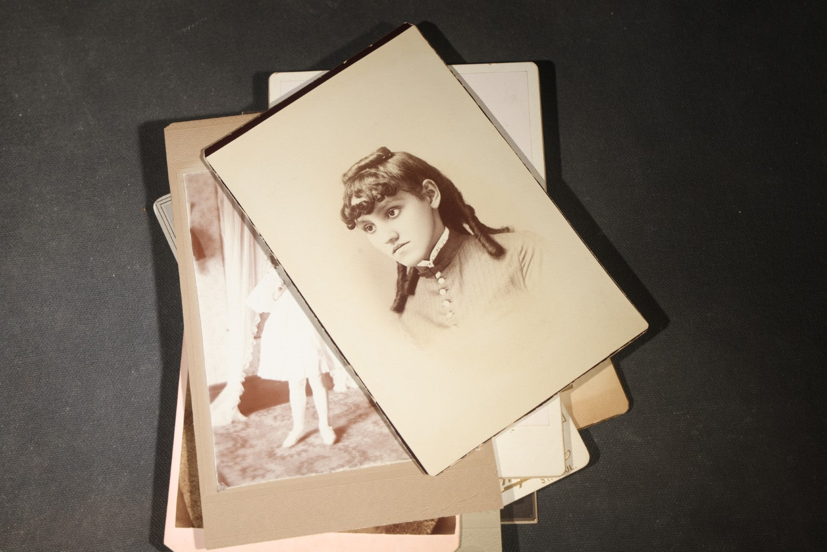 Grouping of 35+ Antique Cabinet Card and Board-Mounted Photographs including Schoolroom Interior and Posed Couple in Fur Coats