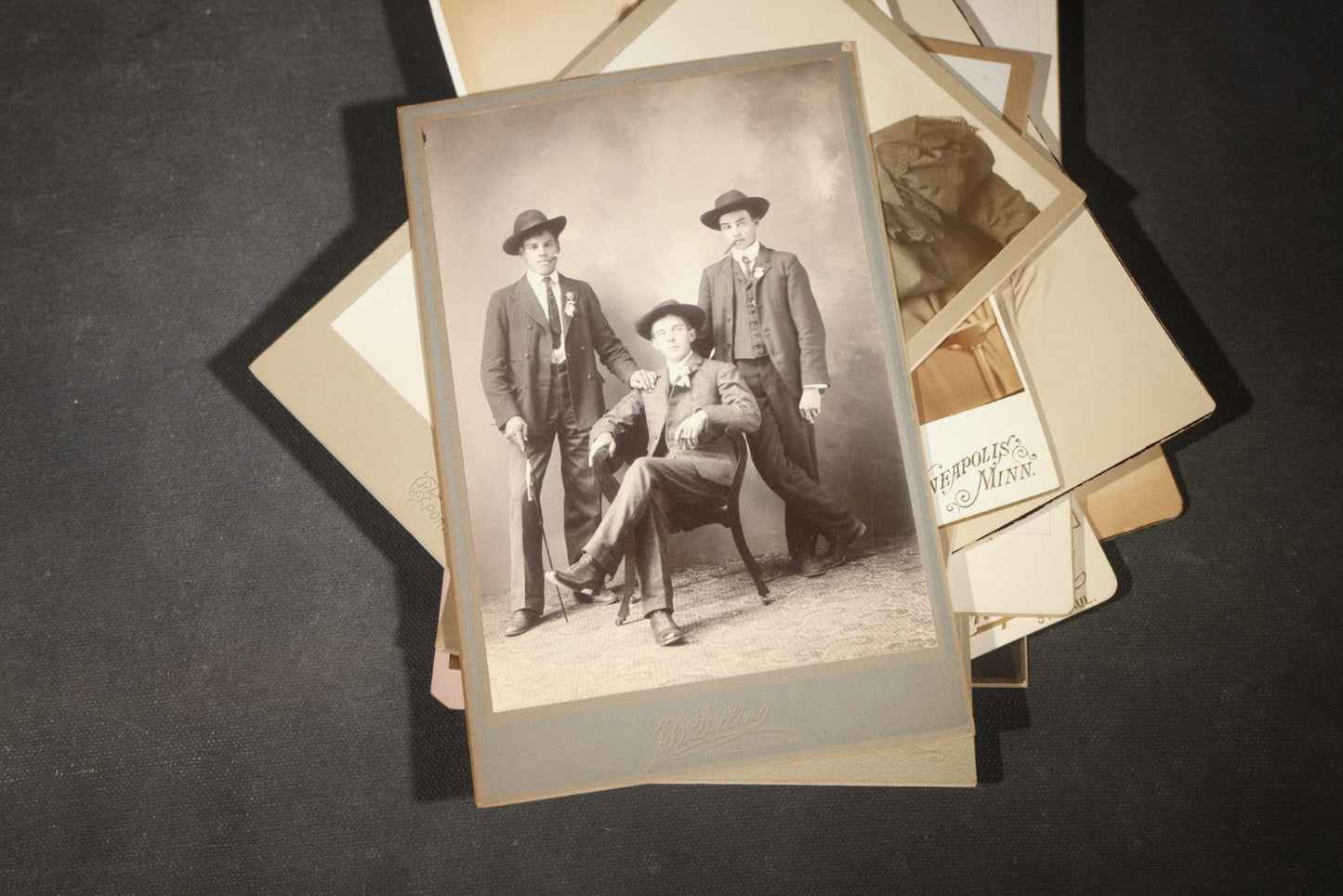 Grouping of 35+ Antique Cabinet Card and Board-Mounted Photographs including Schoolroom Interior and Posed Couple in Fur Coats