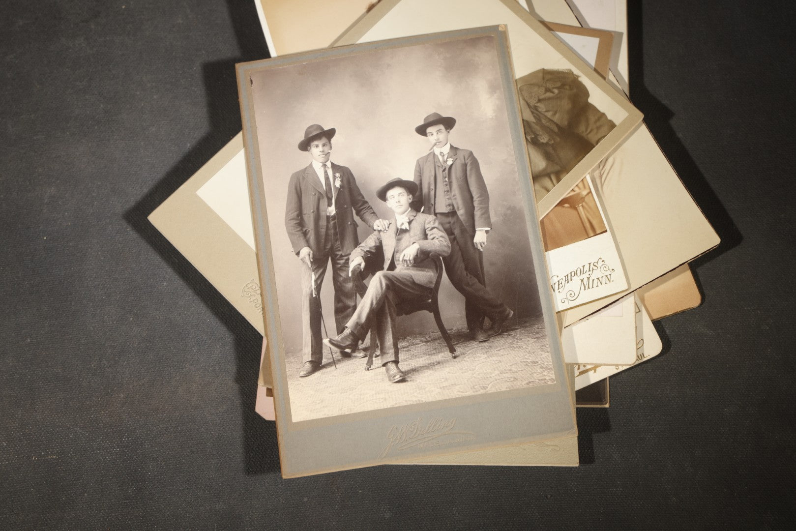 Grouping of 35+ Antique Cabinet Card and Board-Mounted Photographs including Schoolroom Interior and Posed Couple in Fur Coats