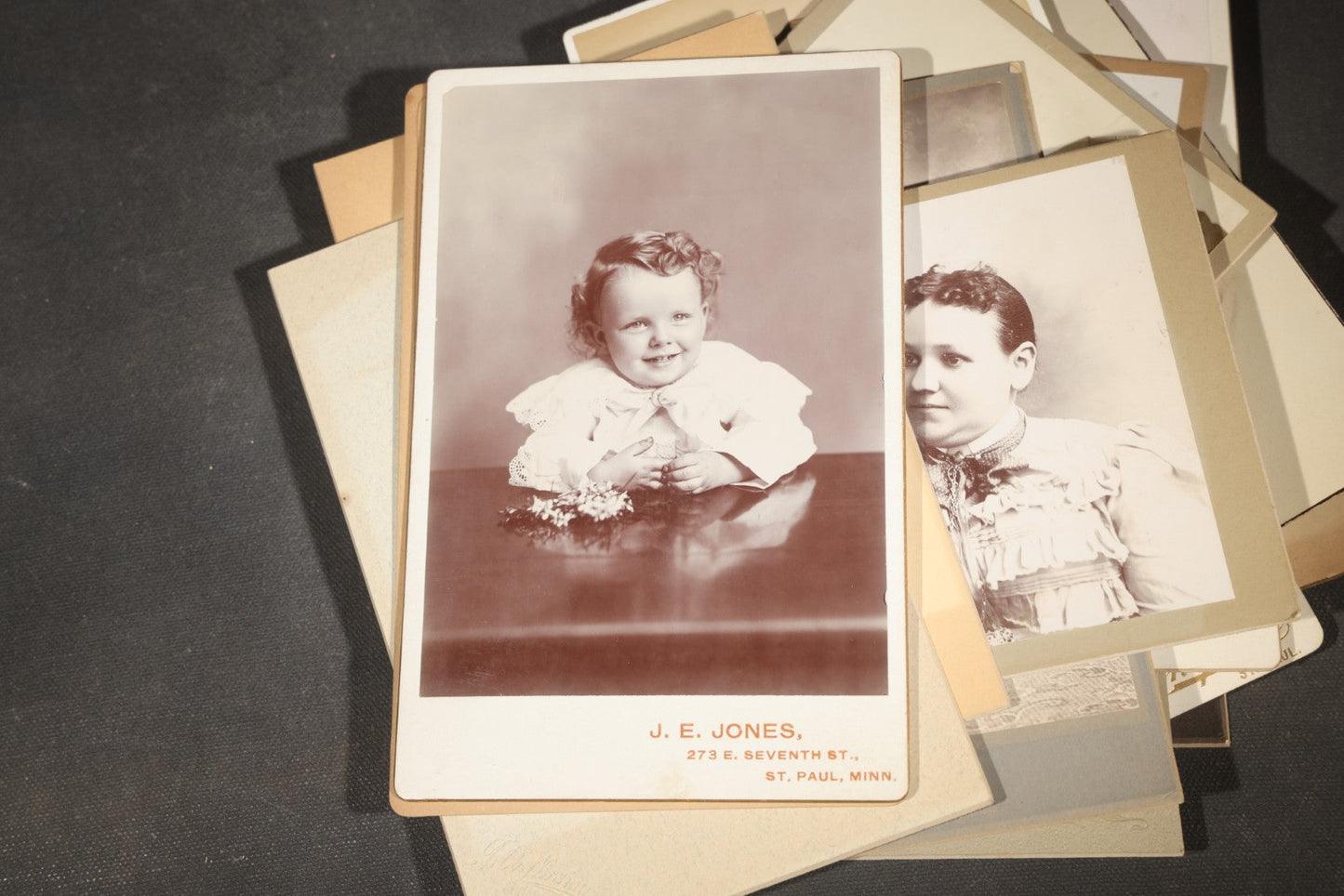 Grouping of 35+ Antique Cabinet Card and Board-Mounted Photographs including Schoolroom Interior and Posed Couple in Fur Coats