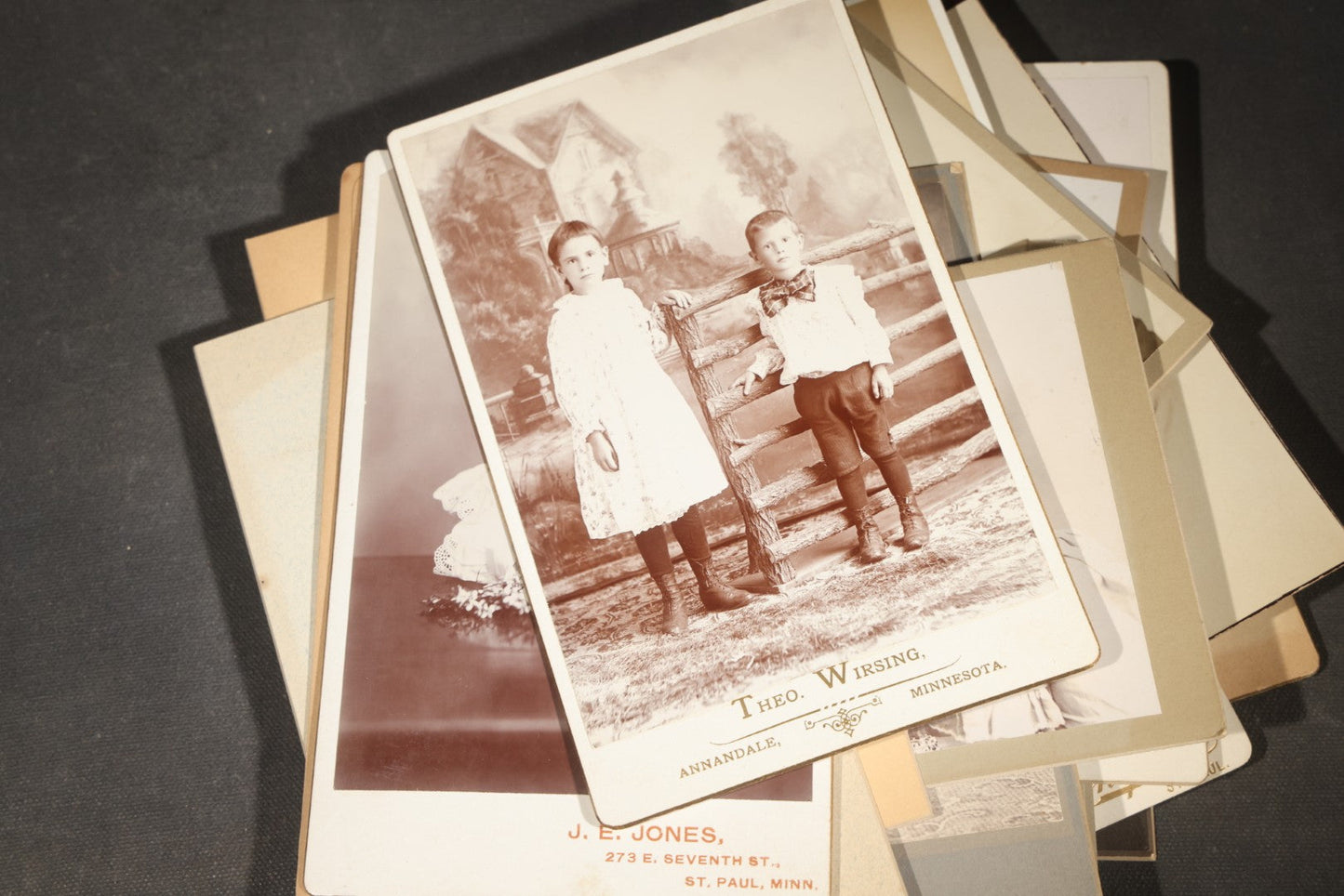 Grouping of 35+ Antique Cabinet Card and Board-Mounted Photographs including Schoolroom Interior and Posed Couple in Fur Coats
