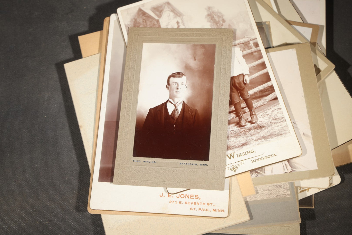 Grouping of 35+ Antique Cabinet Card and Board-Mounted Photographs including Schoolroom Interior and Posed Couple in Fur Coats