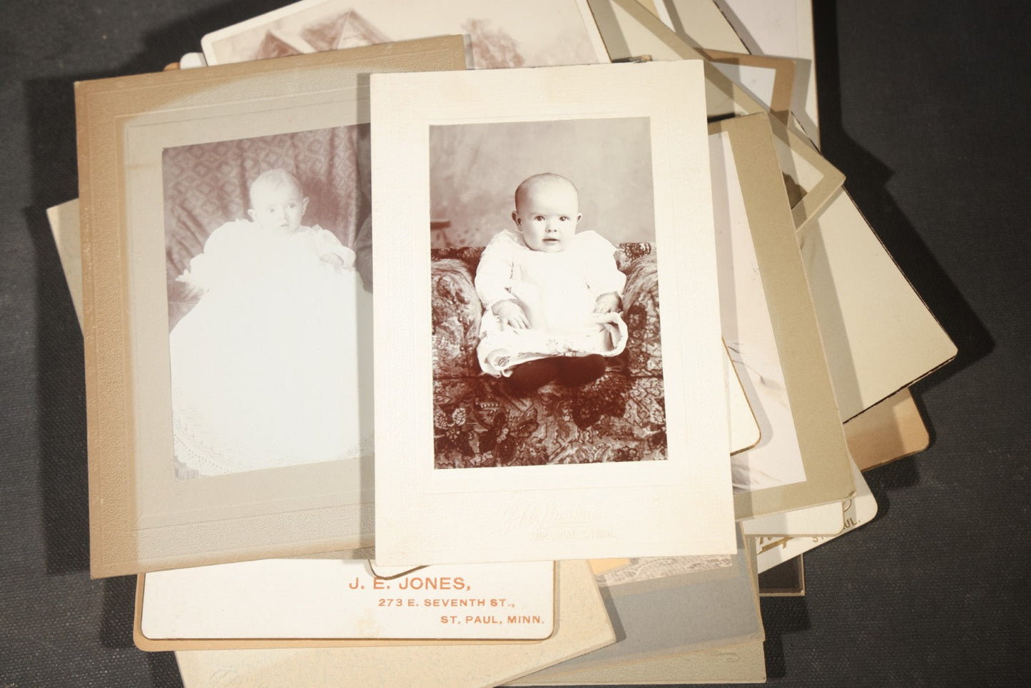 Grouping of 35+ Antique Cabinet Card and Board-Mounted Photographs including Schoolroom Interior and Posed Couple in Fur Coats