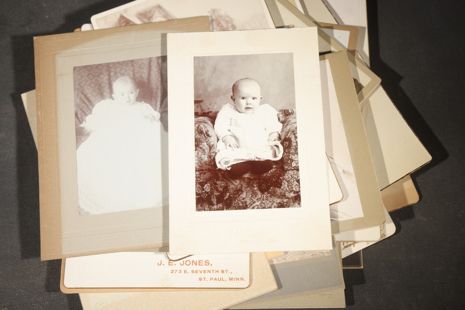 Grouping of 35+ Antique Cabinet Card and Board-Mounted Photographs including Schoolroom Interior and Posed Couple in Fur Coats