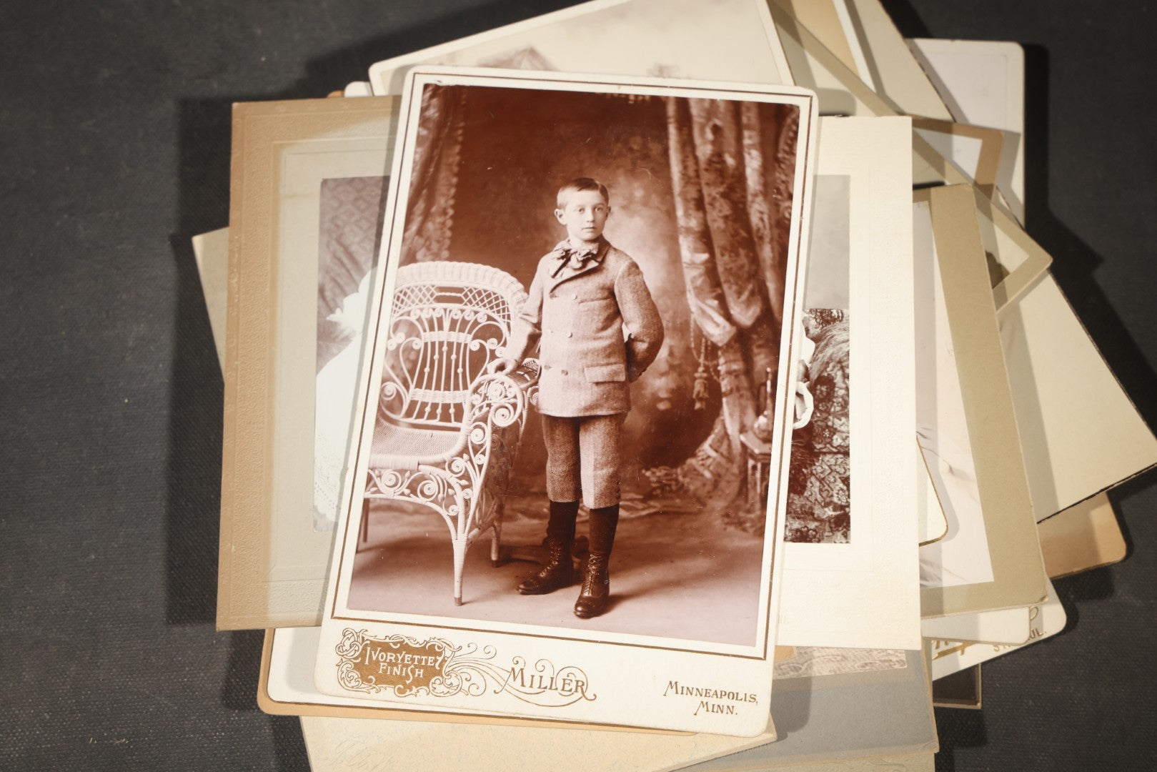Grouping of 35+ Antique Cabinet Card and Board-Mounted Photographs including Schoolroom Interior and Posed Couple in Fur Coats
