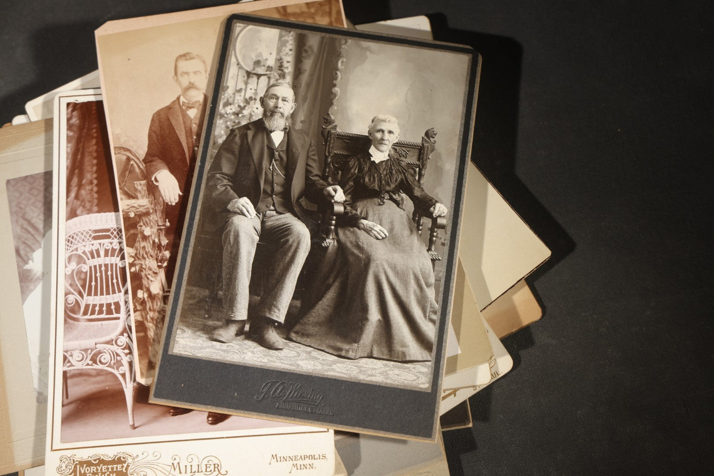 Grouping of 35+ Antique Cabinet Card and Board-Mounted Photographs including Schoolroom Interior and Posed Couple in Fur Coats