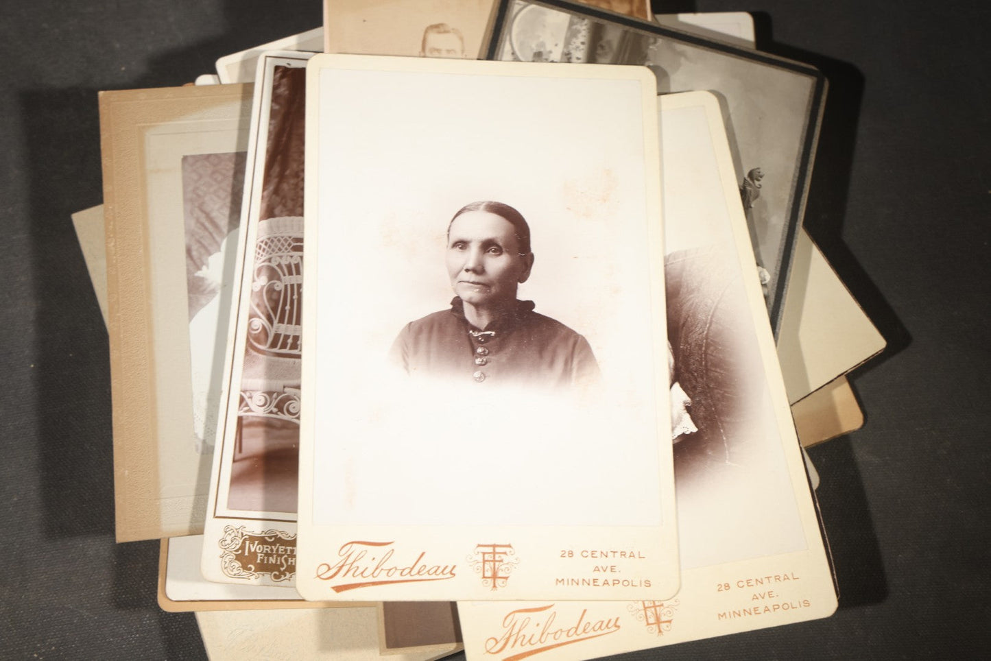 Grouping of 35+ Antique Cabinet Card and Board-Mounted Photographs including Schoolroom Interior and Posed Couple in Fur Coats