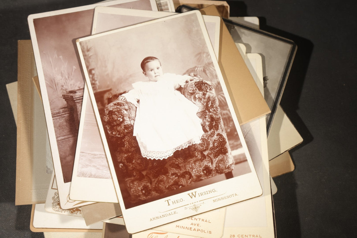 Grouping of 35+ Antique Cabinet Card and Board-Mounted Photographs including Schoolroom Interior and Posed Couple in Fur Coats