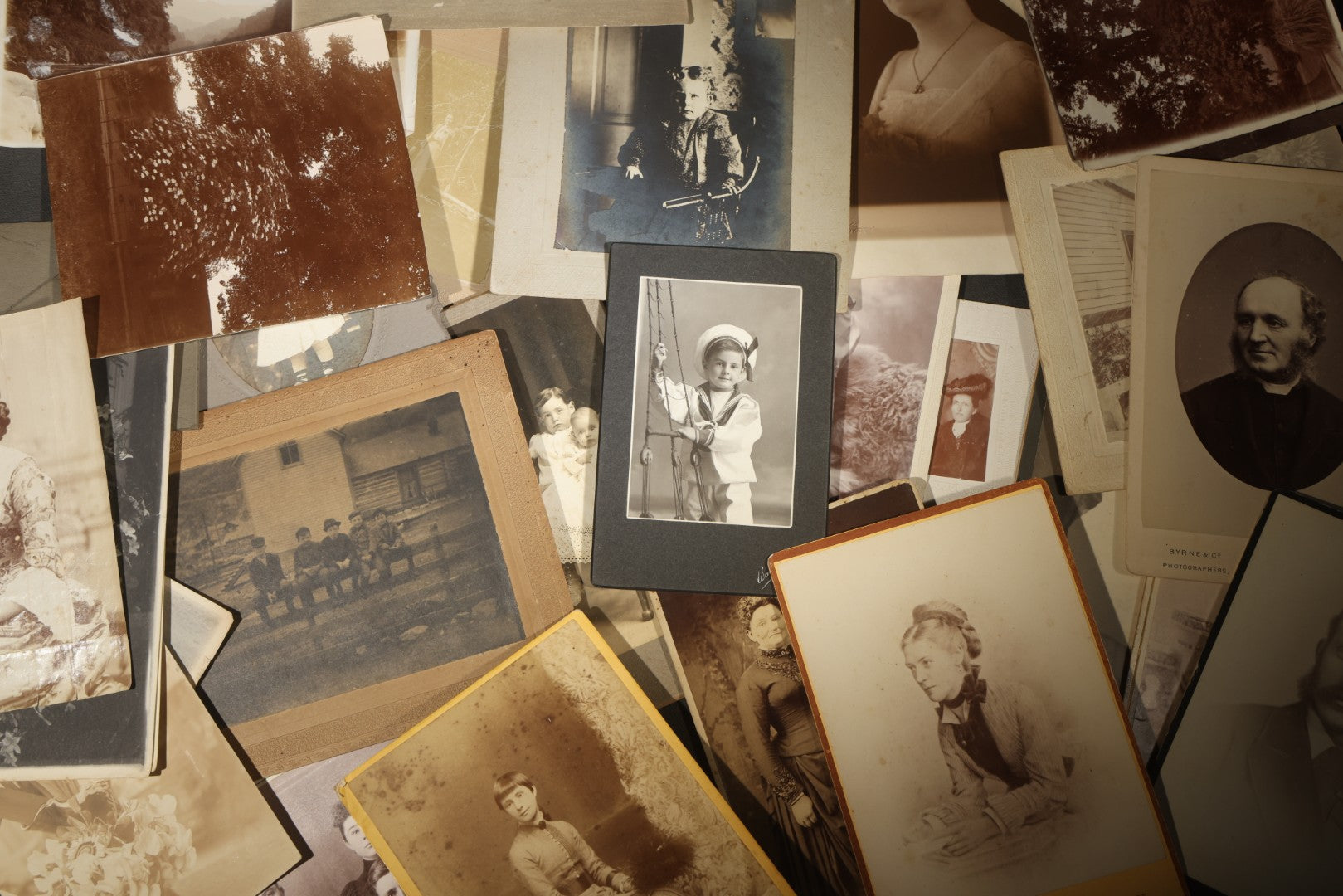Grouping of 30+ Antique Board-Mounted, Cabinet Card, and Unmounted Photographs including Victorian and Edwardian Portraits, Landscapes, and Group Scenes