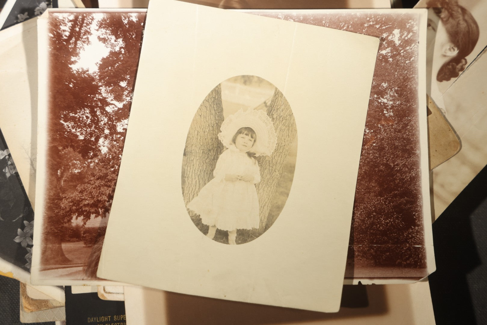 Grouping of 30+ Antique Board-Mounted, Cabinet Card, and Unmounted Photographs including Victorian and Edwardian Portraits, Landscapes, and Group Scenes